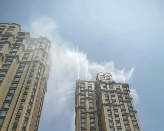 法国媒体点赞中国小区楼顶人工降雨